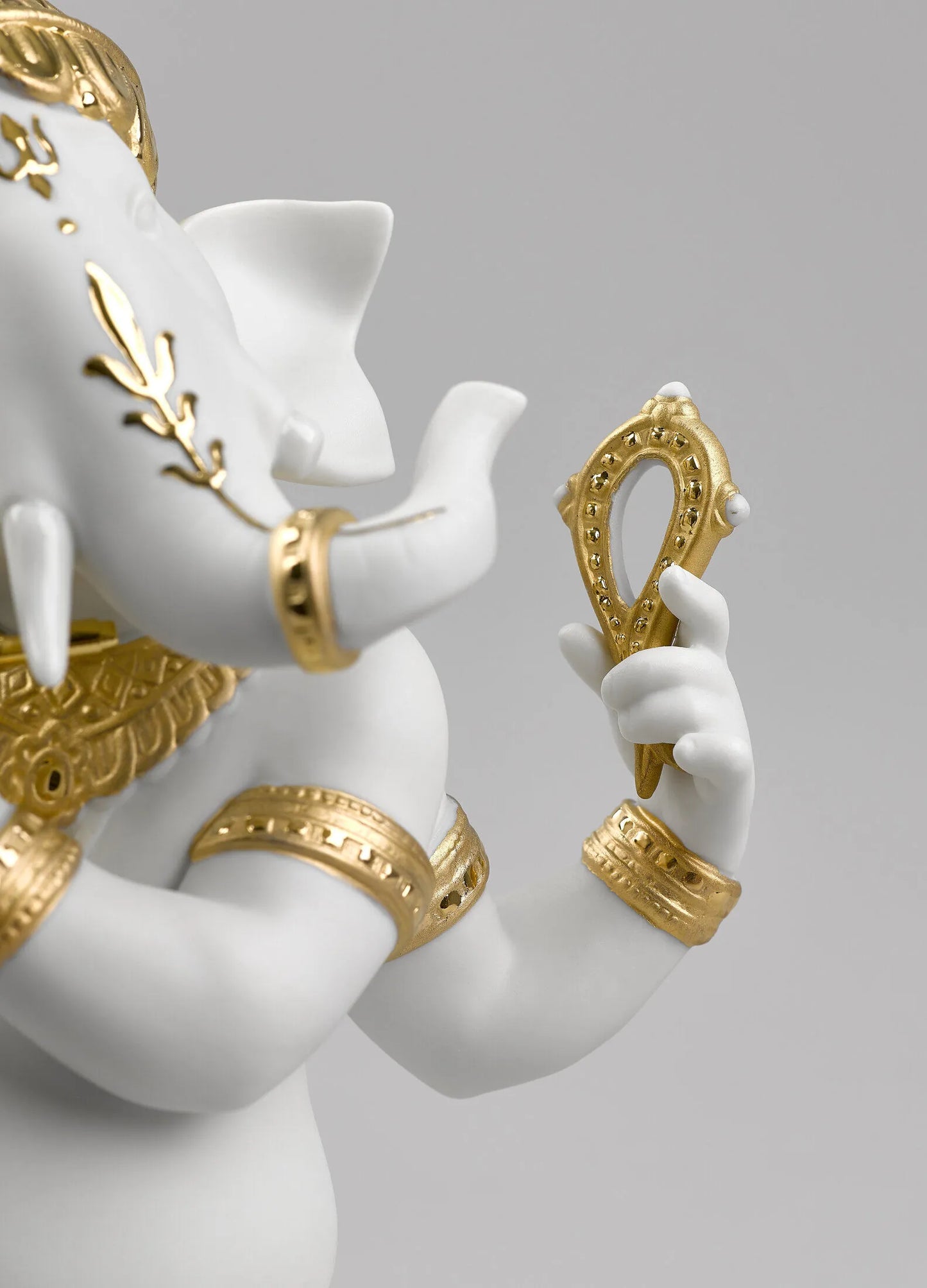 Bansuri Ganesha Figurine. Golden Lustre