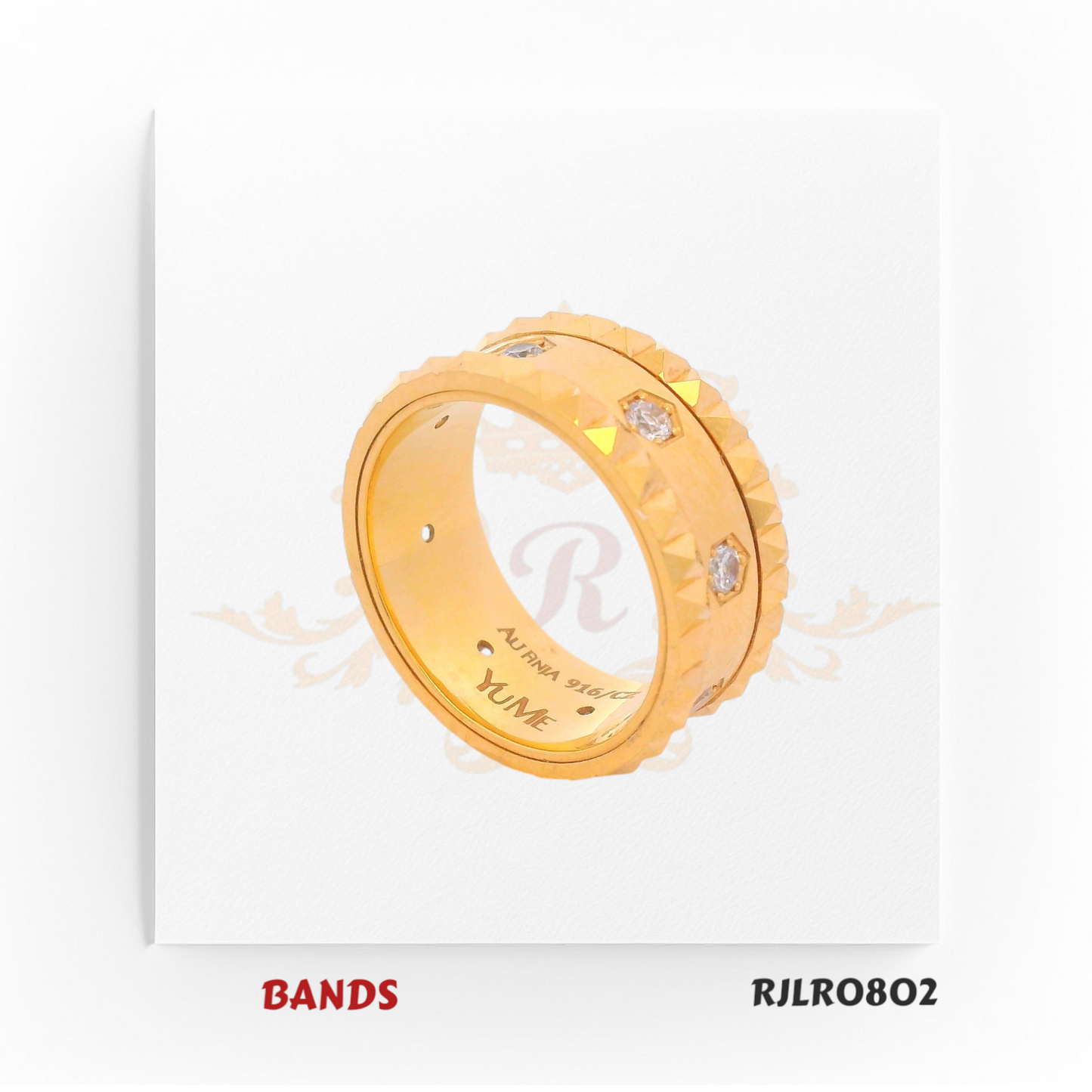 Striking 22kt yellow gold band with sharp faceted edges and bezel-set diamond accents, exuding a refined yet masculine elegance. Model RJLR0802.