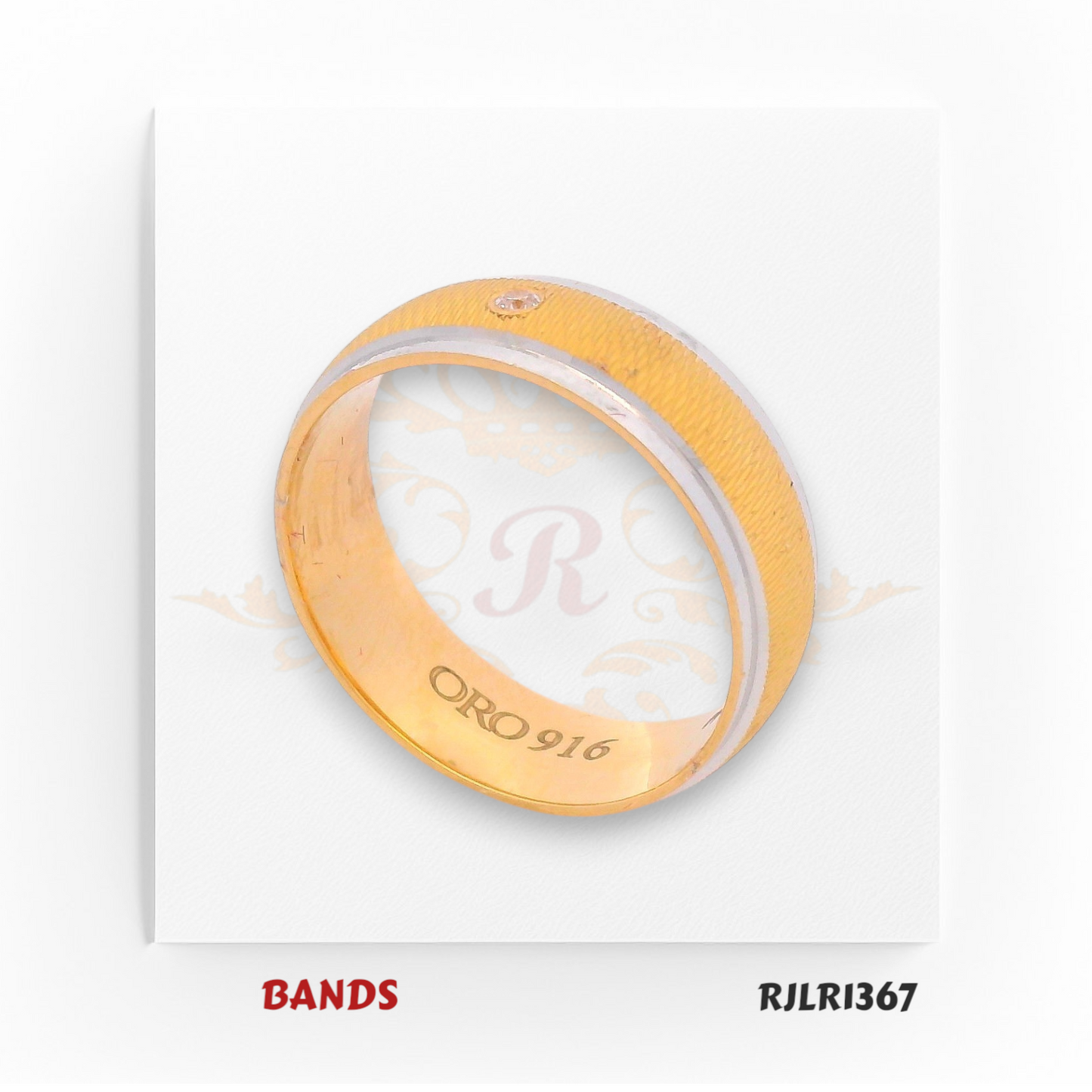 Crafted in 22kt two-tone gold, this band pairs bold yellow gold edges with a crisp white gold center and a brilliant diamond touch. Model RJLR1367 offers a striking balance of contemporary style and classic elegance.