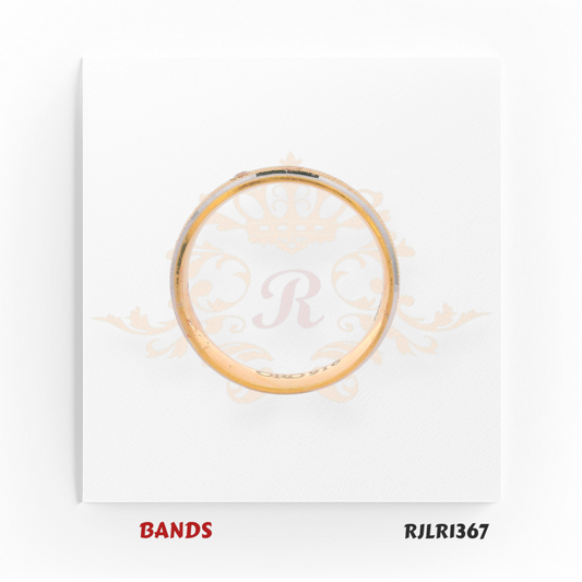 Two-tone 22kt gold band featuring a yellow gold base with a white gold center stripe and a small embedded diamond accent. Modern and sophisticated. Model number RJLR1367.