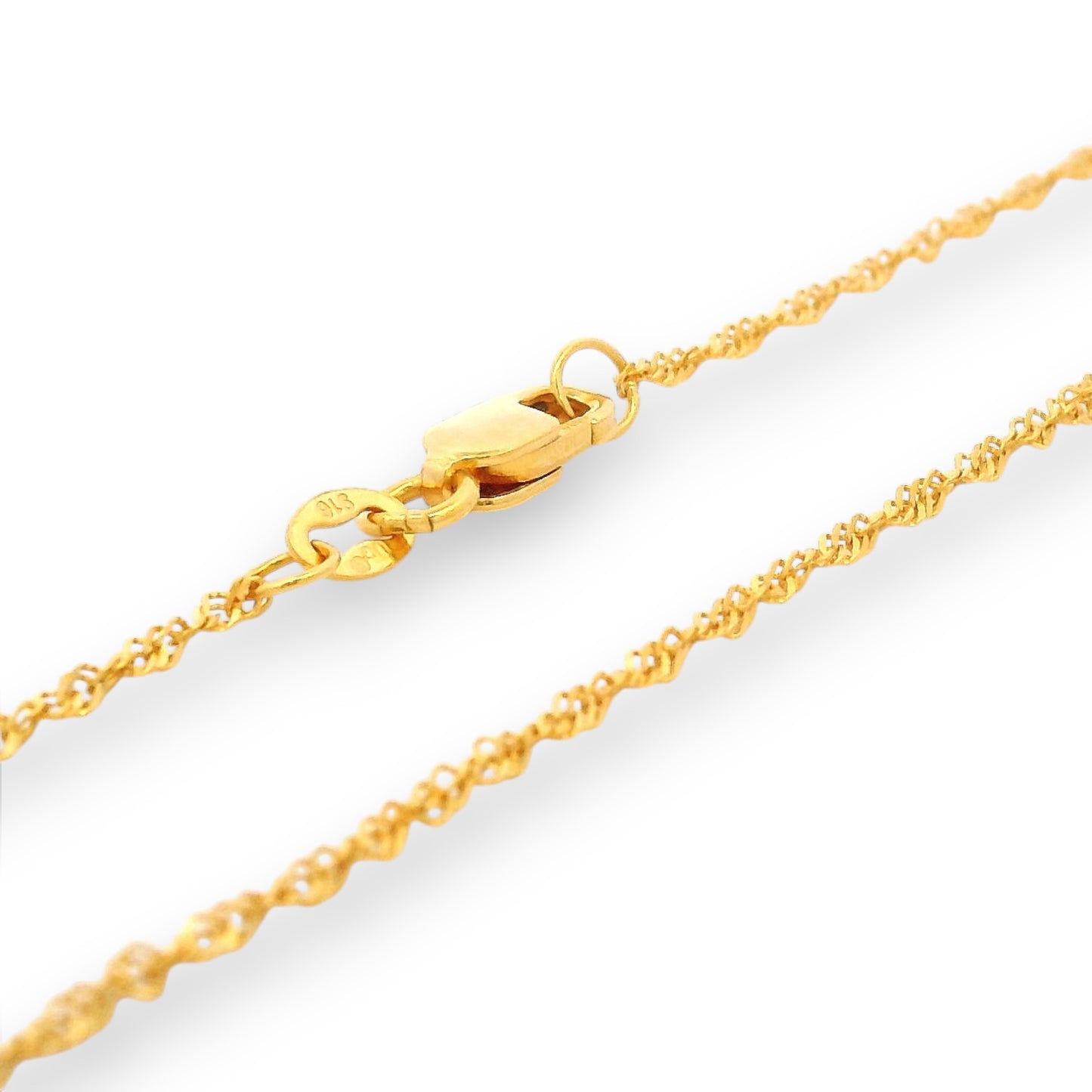 Detailed view of 22K gold baby chain (RJC30870a) showing refined twisted links and sturdy clasp. Regal Jewels Chicago’s premium gold craftsmanship ensures lasting shine and baby-safe wearability.
