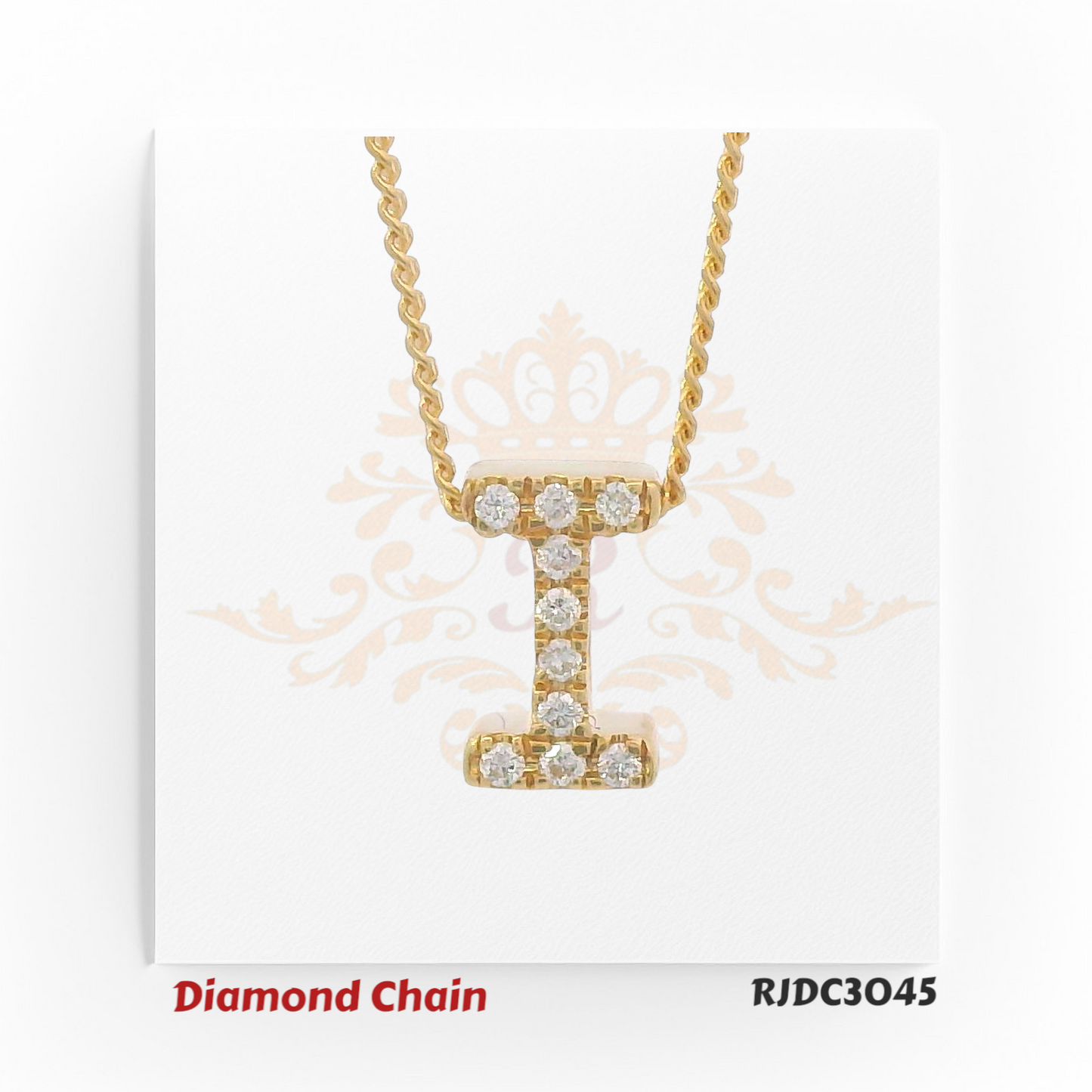 Classic yellow gold diamond chain with a pendant shaped like the letter "I", encrusted with shimmering round-cut diamonds. The pendant is attached to a twisted rope-style gold chain, presented on a white background with a regal crown and floral design. Model number RJDC3045.