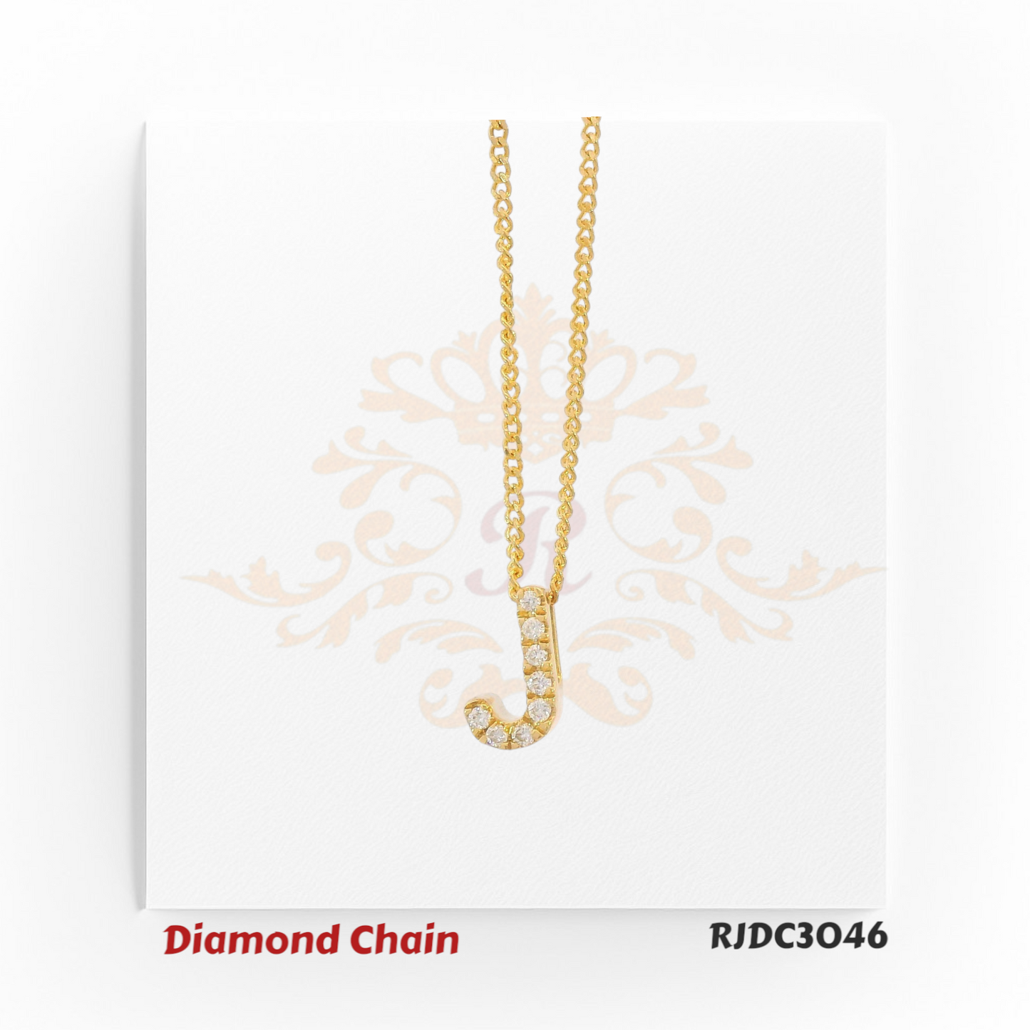 Radiant yellow gold diamond chain with a letter “J” pendant, elegantly set with round-cut diamonds and paired with a twisted gold rope chain. Model RJDC3046.