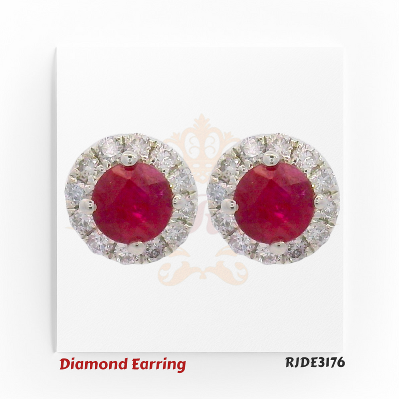 Pair of 18kt white gold earrings featuring round rubies surrounded by a halo of diamonds – 0.12ct diamonds, 0.50ct ruby, Code RJDE3176
