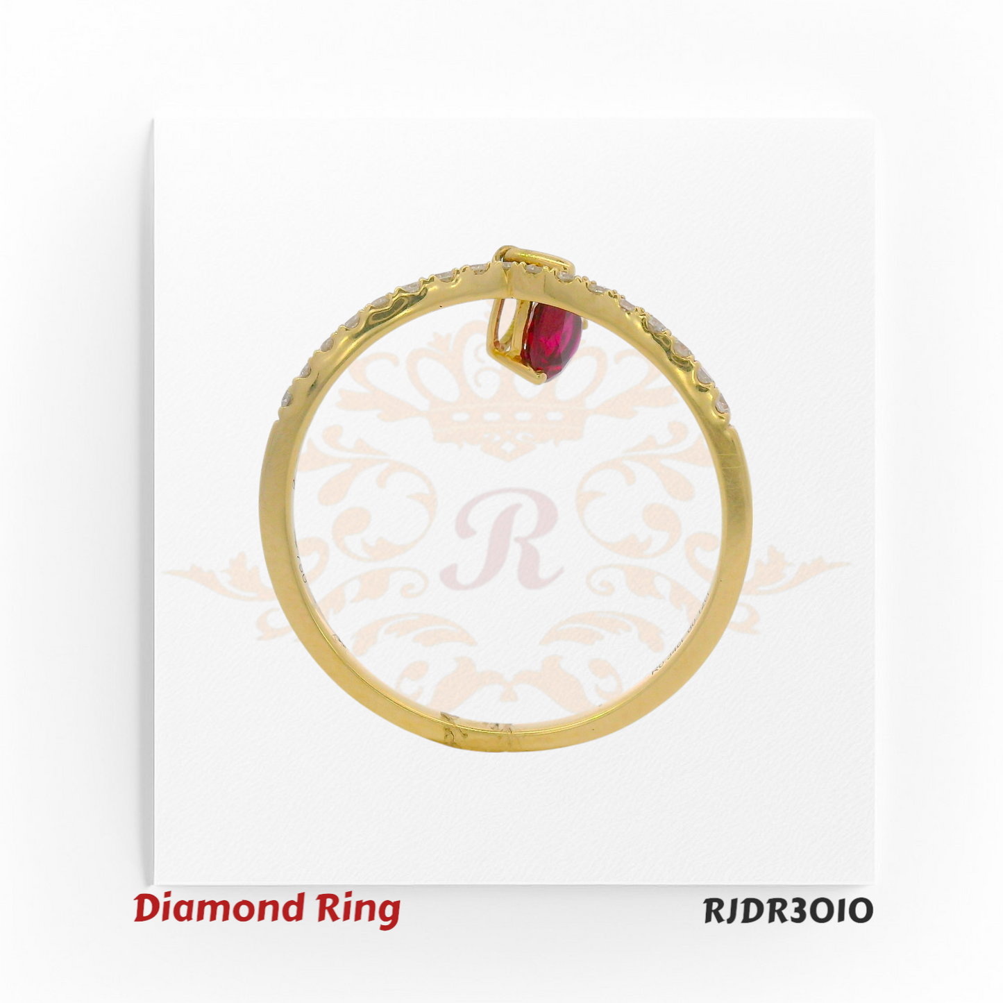 Elegant 18kt yellow gold ring featuring a V-shaped diamond band accented with a dangling pear-cut ruby – RJDR3010.