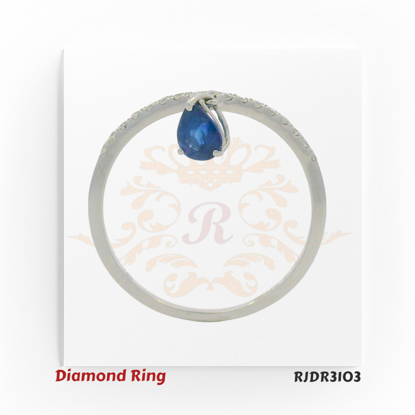 Elegant V-band design in 18kt white gold, showcasing a pear-shaped sapphire drop complemented by round diamond accents – RJDR3103.
