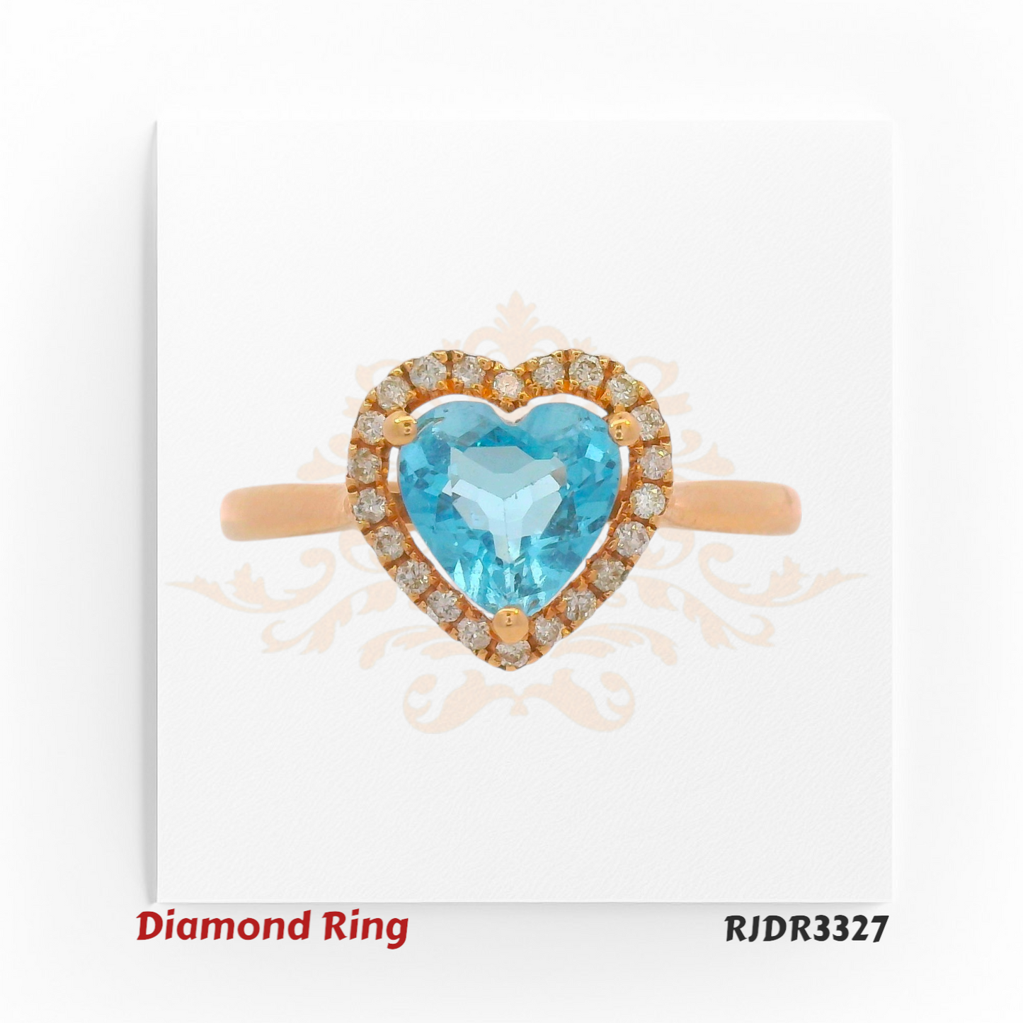 Romantic 18kt rose gold design featuring a brilliant heart-shaped blue topaz, elegantly framed by a halo of shimmering diamonds – RJDR3327.