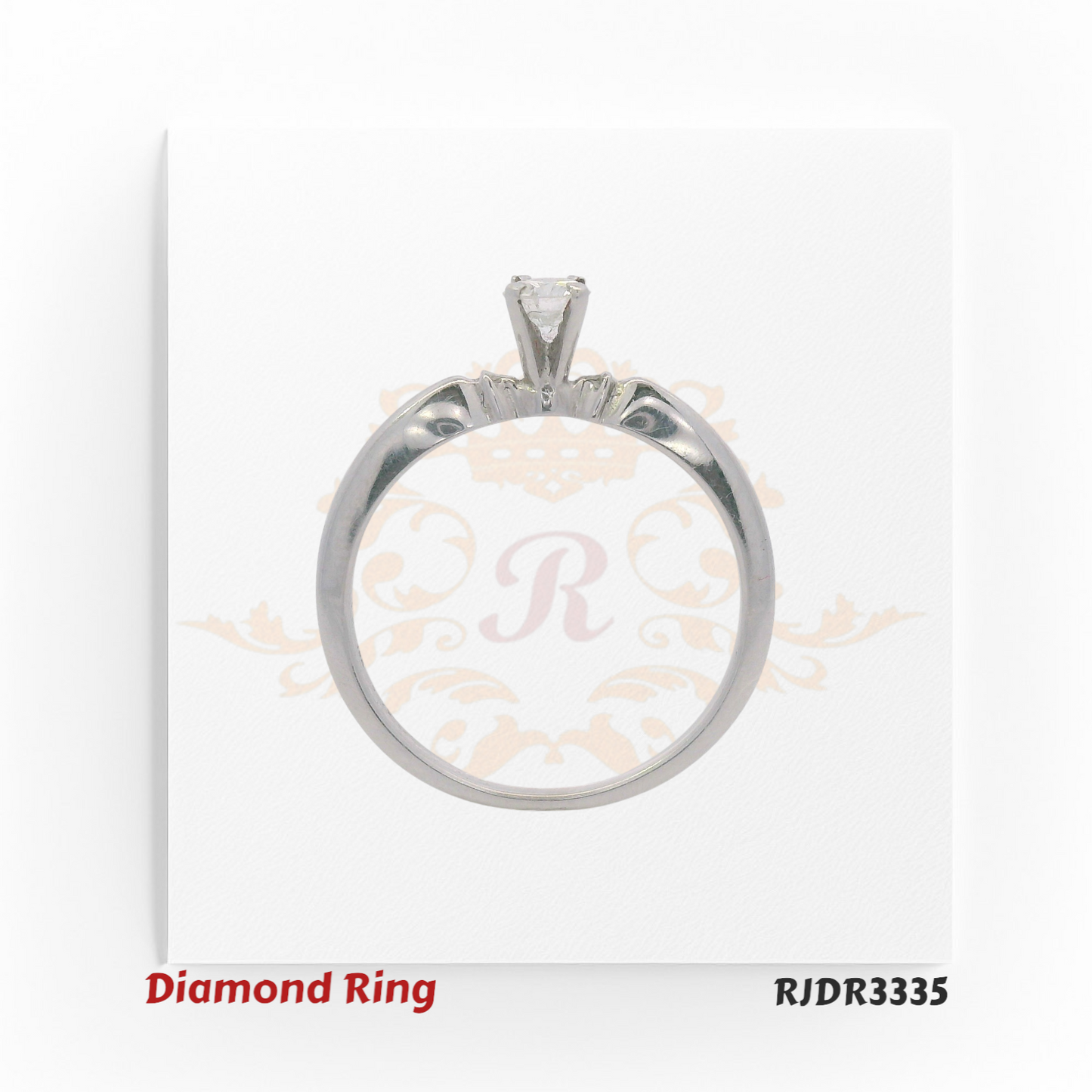 Elegant 18kt white gold solitaire ring showcasing a 0.19 ct VS-clarity diamond at the center. Size 6 – RJDR3335.