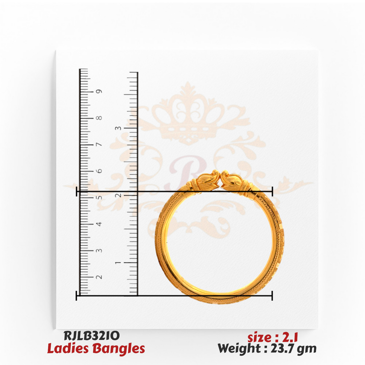 Top view of a gold ladies bangle featuring twin peacock head motifs at the clasp and intricate engraved detailing along the band, shown with a ruler for precise measurement. Model RJLB3210.