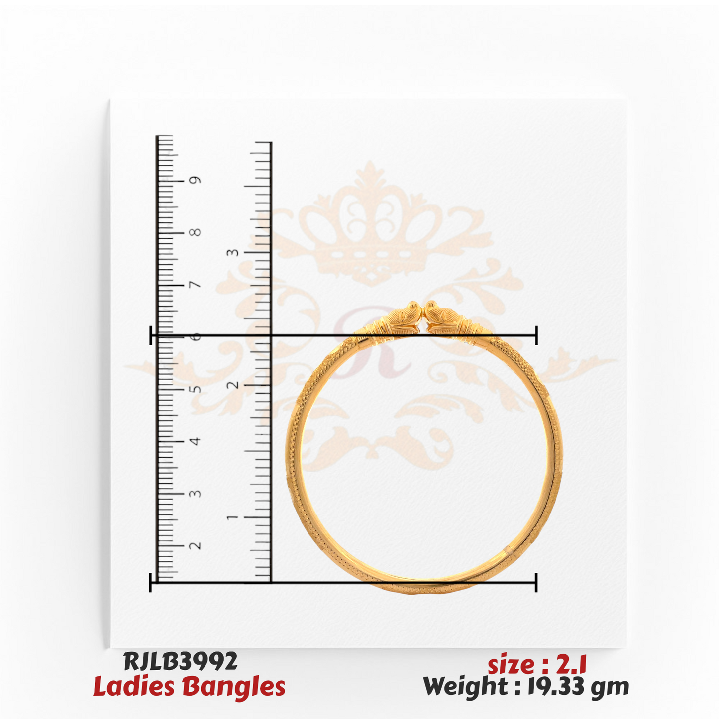 Top view of a gold ladies bangle featuring twin peacock head motifs at the clasp and intricate detailing along the band, displayed with a ruler for precise sizing. Model RJLB3992.
