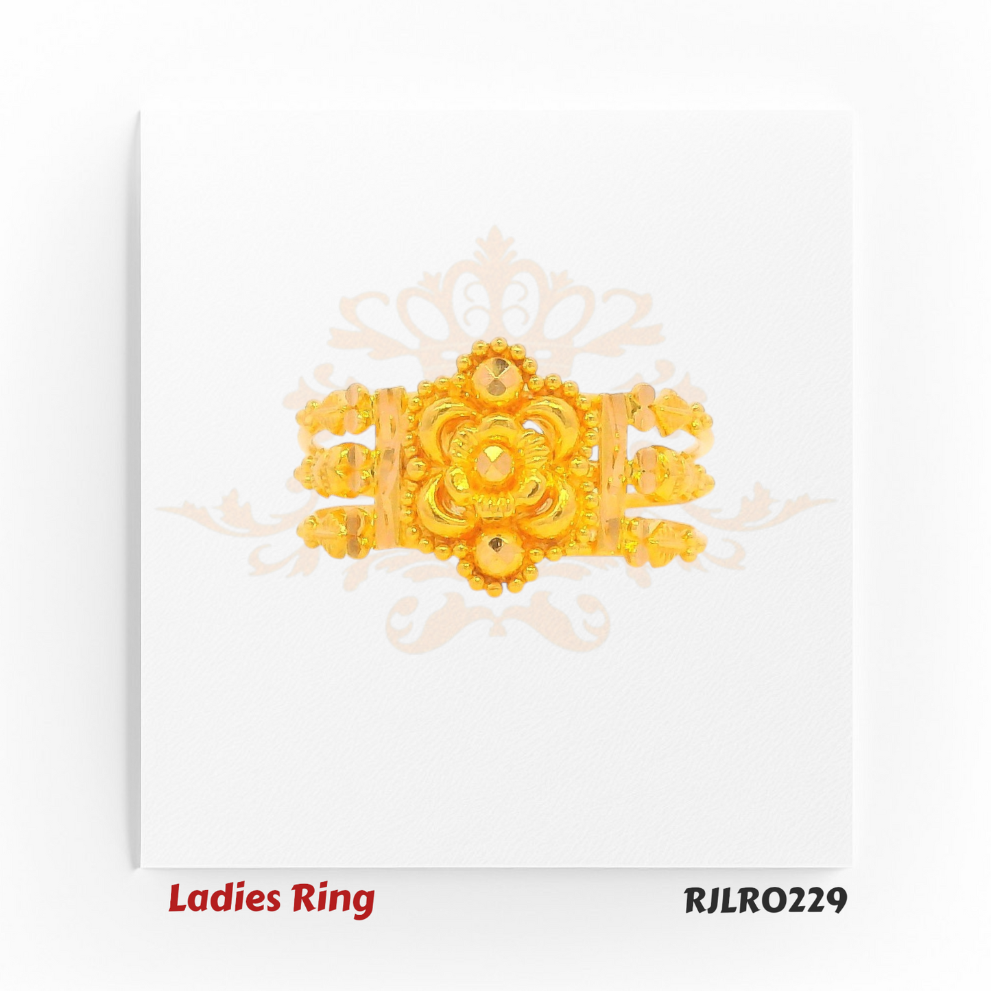 Gold statement ring with a broad band, featuring a detailed central flower, layered petal patterns, and intricate golden beading for a rich traditional look. Model RJLR0229.