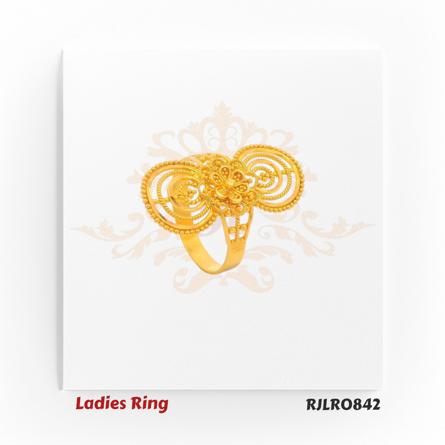 Long statement ladies gold ring featuring concentric circular patterns above and below a central floral motif, perfect for festive and bridal occasions. RJLR0842