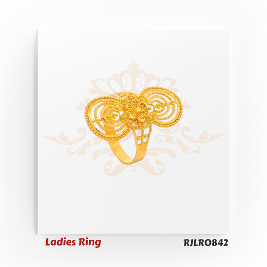 Long statement ladies gold ring featuring concentric circular patterns above and below a central floral motif, perfect for festive and bridal occasions. RJLR0842