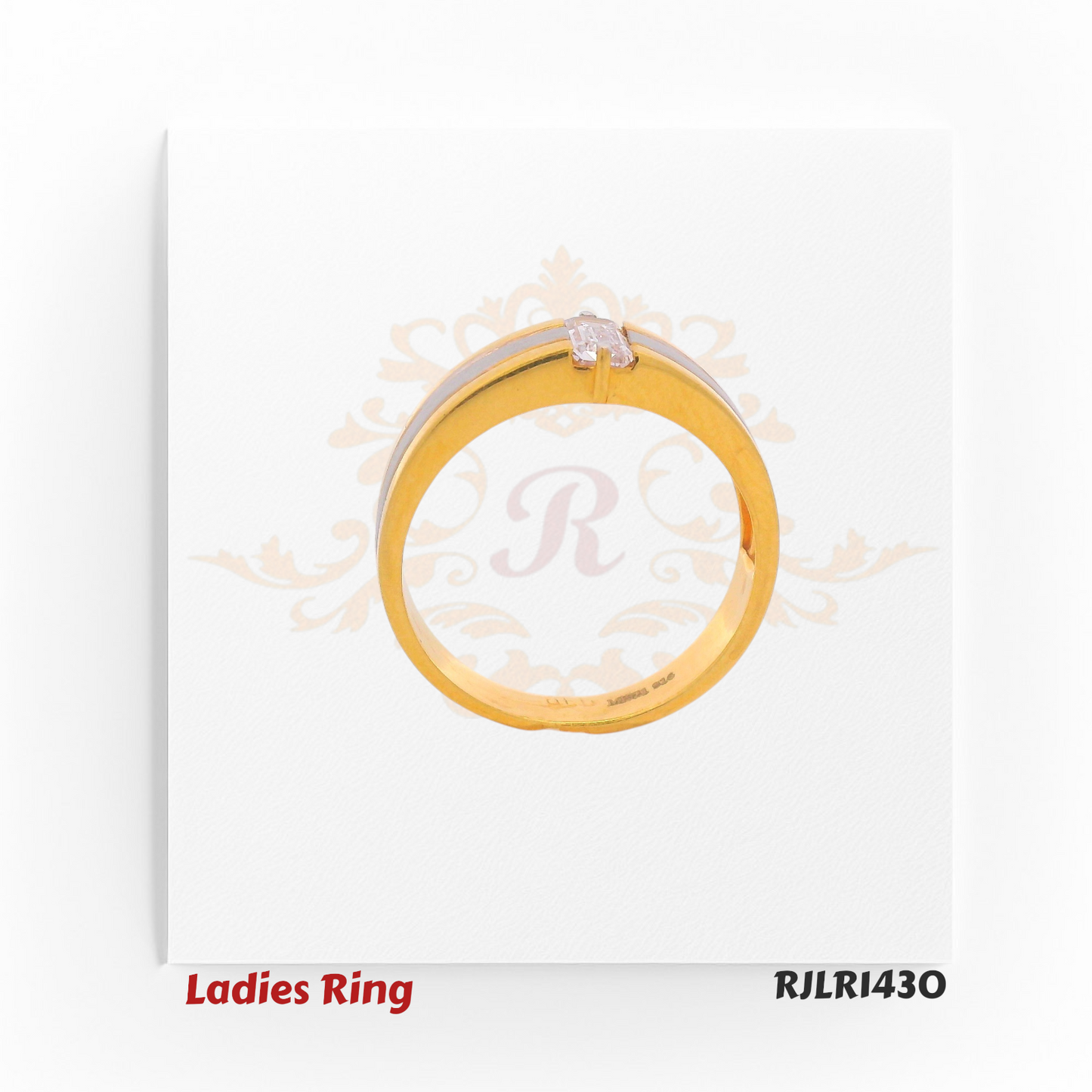 Side profile view of a contemporary ladies gold ring showing the raised baguette stone setting and contrasting rhodium strip along the shank. Model RJLR1430.