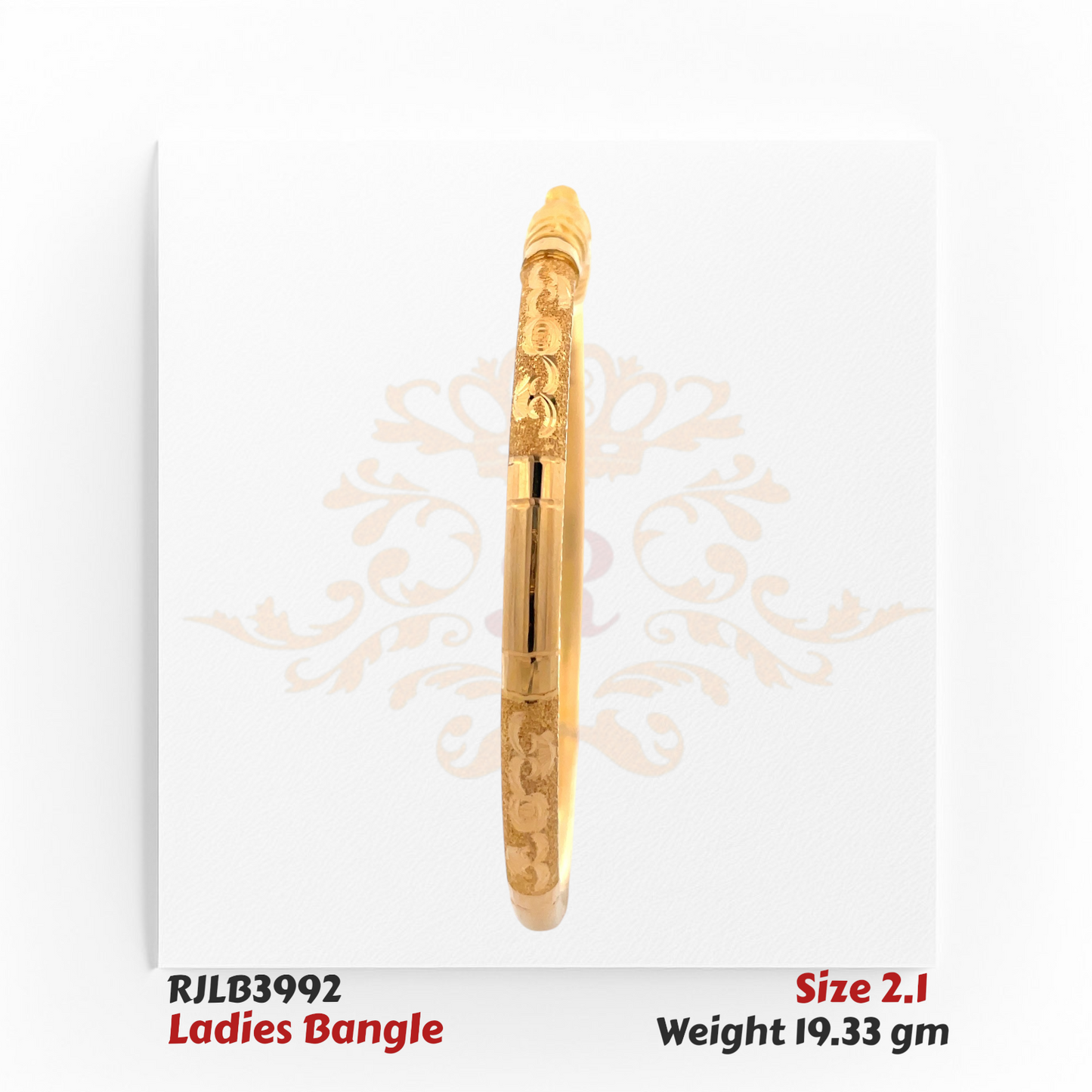 Side profile view of a gold ladies bangle adorned with delicate scroll engravings and fine textured detailing, showcasing a graceful and traditional aesthetic. Model RJLB3992.