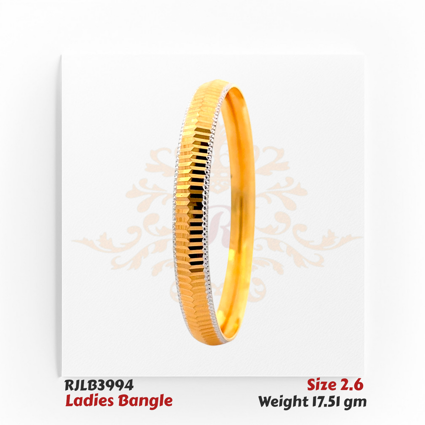 Angled view of a gold ladies bangle featuring a sleek central row of alternating gold and black faceted segments, bordered by delicate white-edged detailing for a modern and elegant finish. Model RJLB3994.