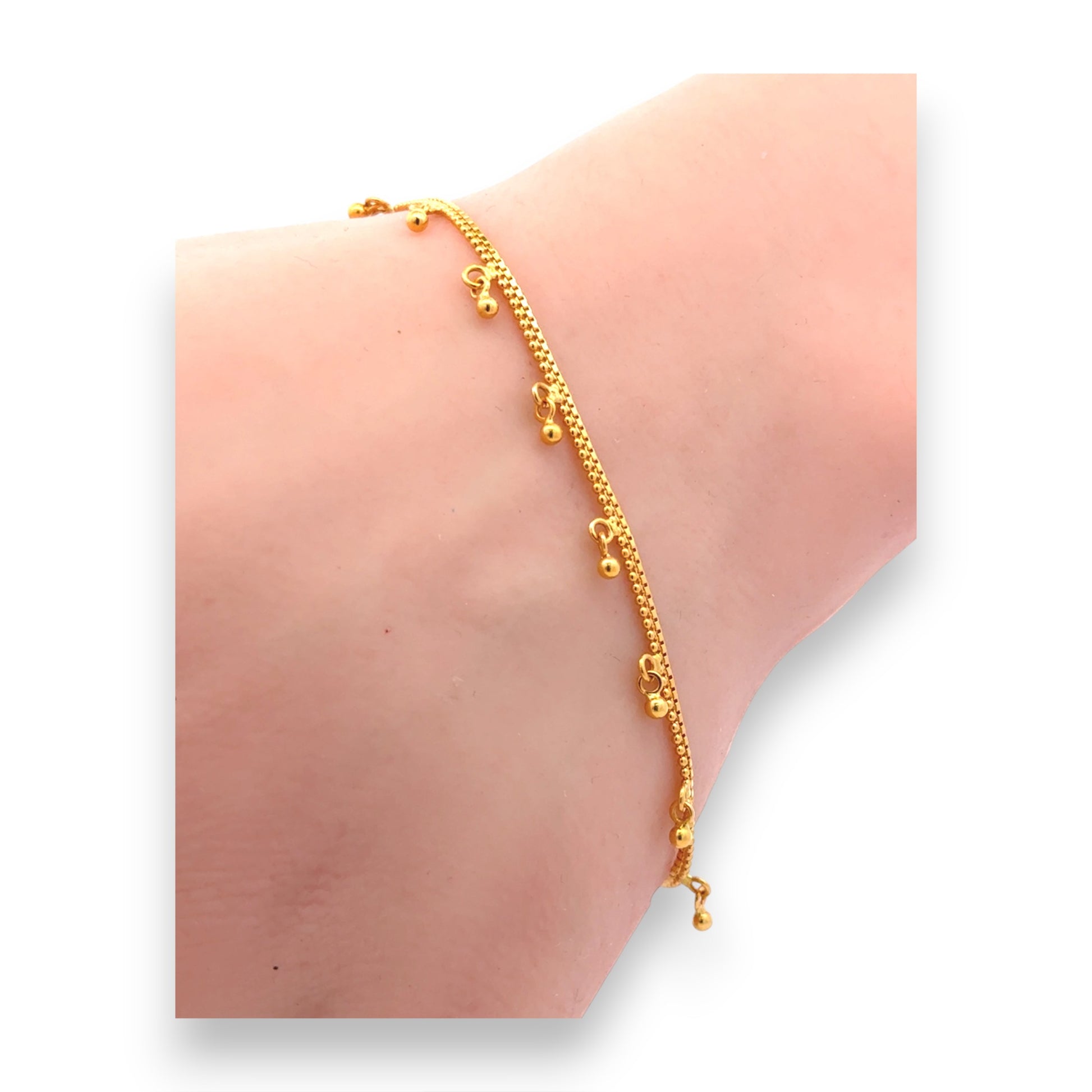 22kt Yellow Gold Snake Chain Bracelet with Dangling Mini Bell Charms – Delicate and Minimalist Women’s Bracelet – Regal Jewels RJLB4054