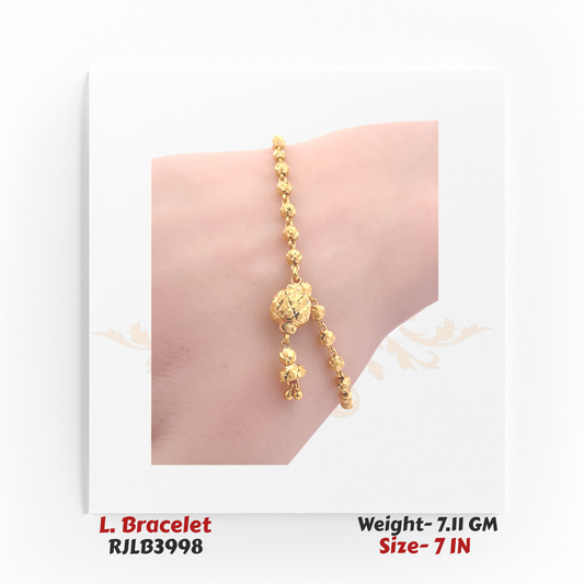 Close-up view of a traditional gold ladies bracelet featuring a linked chain of small spherical gold beads with an ornate central bead charm and two dangling gold accents, crafted in a 7-inch size. Model RJLB3998.