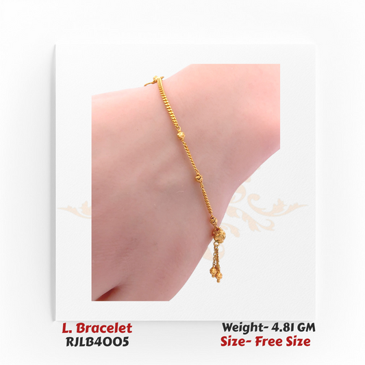 Graceful ladies’ bracelet with fine yellow gold chain links interspersed with small beads and a dangling decorative charm cluster. RJLB4005