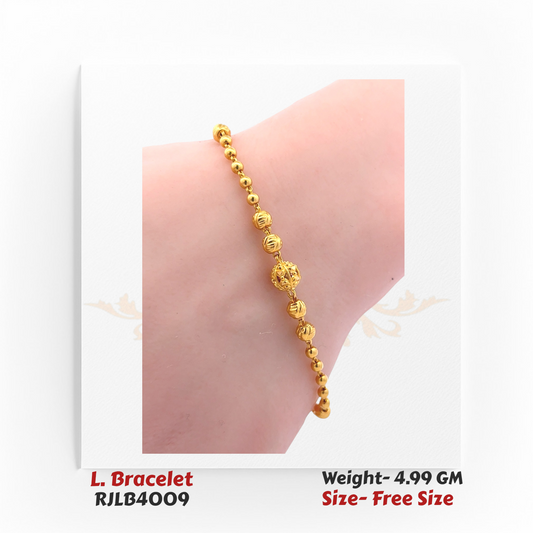 Minimalist ladies’ bracelet composed of smooth and textured yellow gold beads, with a larger ornate bead centerpiece. RJLB4009