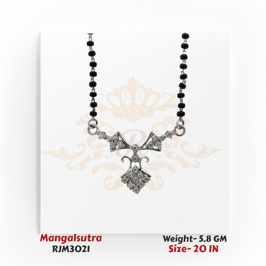 Close-up view of a modern mangalsutra featuring a sleek white gold-toned pendant adorned with sparkling stones in an intricate bow and diamond-shaped design. The pendant is attached to a traditional black-beaded chain, blending contemporary elegance with cultural tradition. Model RJM3021.