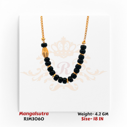 Close-up view of a minimalist gold mangalsutra featuring a sleek arrangement of glossy black beads separated by small gold spacers, accented with a single faceted gold bead on one side for an asymmetrical touch. Suspended from a fine gold chain, the design blends simplicity with modern elegance. Model RJM3060.