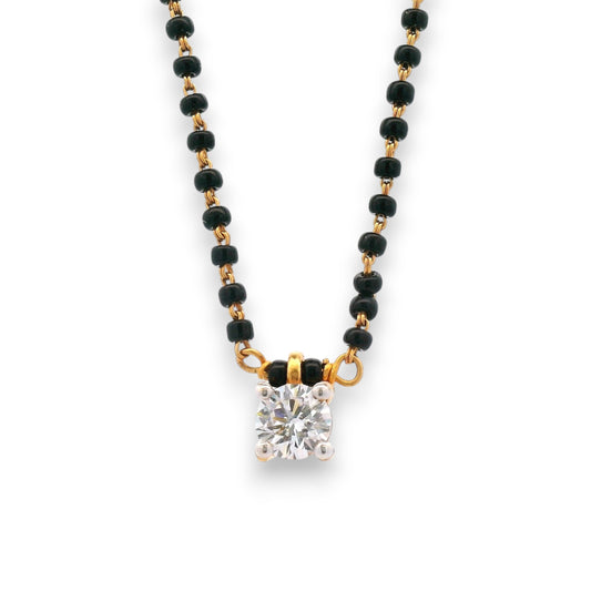 Close-up of single diamond pendant on black beaded gold chain – RJM3148A by Regal Jewels