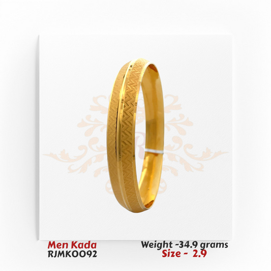 Men’s 22kt gold kada featuring a refined matte chevron-textured exterior with a sleek central groove, complemented by a high-polish interior. Product code RJMK0092, weighing 34.9 grams, size 2.9.