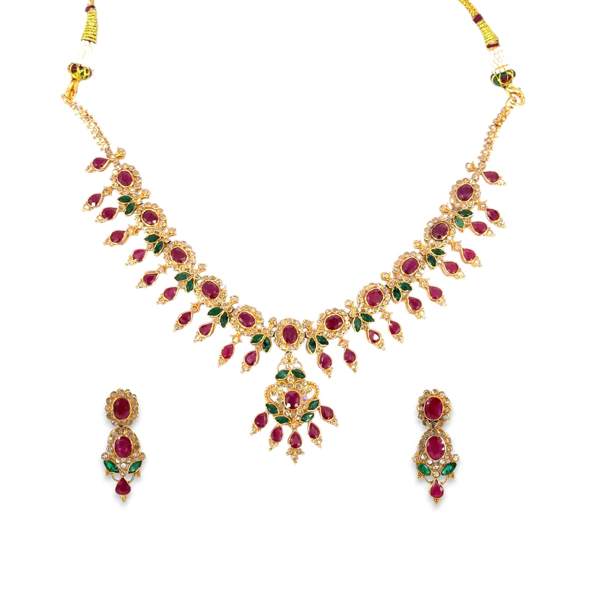 22kt Gold Bridal Necklace Set RJOMS3039 featuring a floral gemstone design with ruby and emerald settings, teardrop detailing, and a matching pair of elegant drop earrings – a luxurious handcrafted bridal jewelry piece from Regal Jewels Chicago.