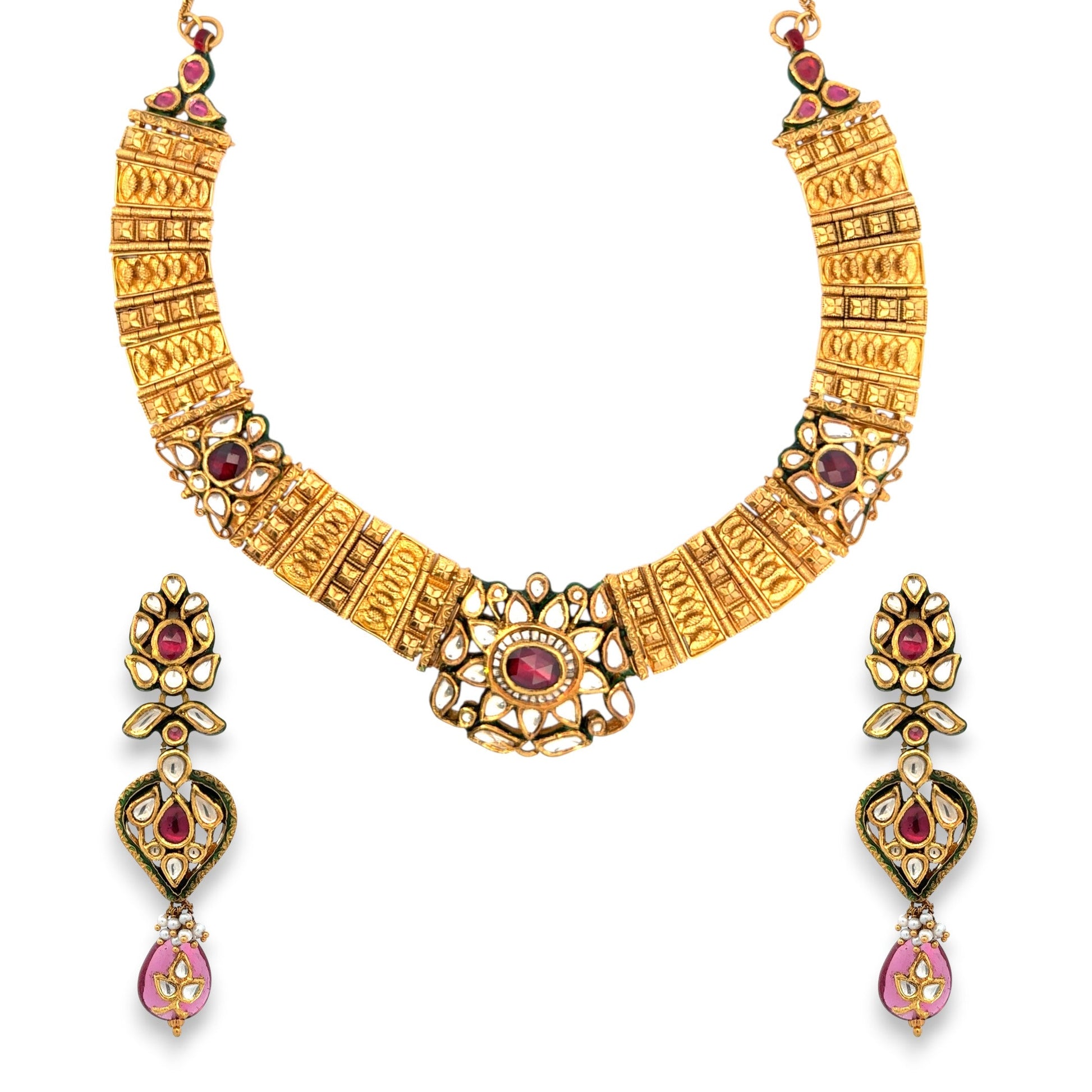 Royal 22kt gold antique Kundan necklace set featuring embossed gold panels with ruby and polki detailing, intricate floral motifs, and matching long earrings. Perfect for bridal, festive, and traditional wear from Regal Jewels Chicago.