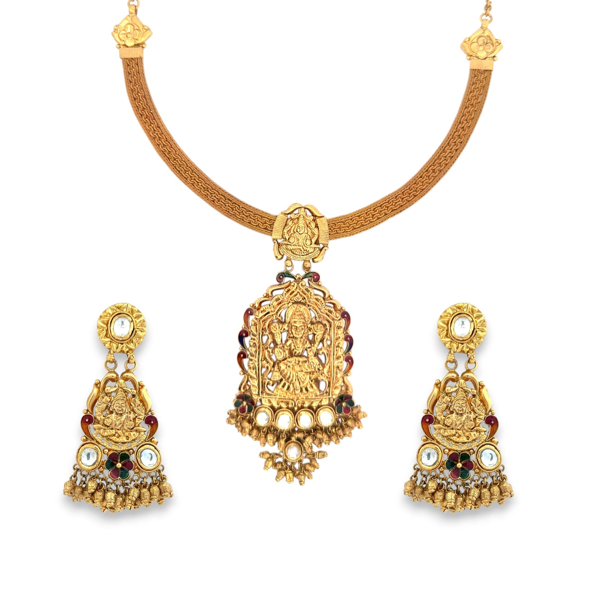 Magnificent 22kt gold temple necklace set featuring Goddess Lakshmi motifs, red and green enamel accents, and intricate gold ghungroo drops with matching earrings. Ideal for bridal, festive, and religious wear from Regal Jewels Chicago.