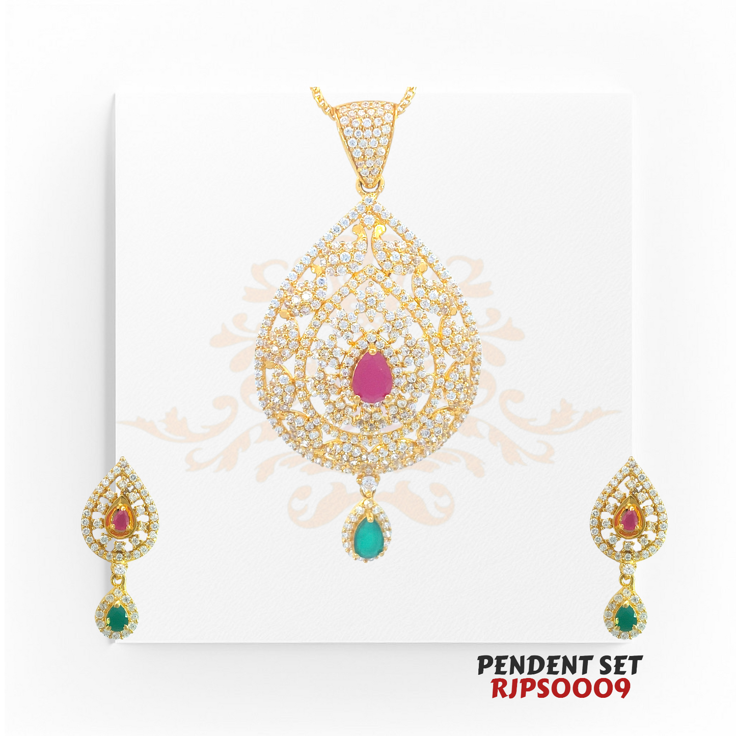 2kt Gold Ruby & Emerald CZ Pendant Set RJPS0009 – A 22.90-gram gold pendant set featuring a teardrop design, pear-cut ruby, emerald drop, and CZ embellishments. Available at Regal Jewels.