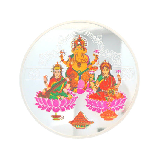 Round silver coin featuring Lord Ganesha with Goddess Lakshmi and Goddess Saraswati seated on lotus flowers, adorned with vibrant detailing, Regal Jewels silver coin RJSB0017 – ideal for Diwali, puja rituals, and gifting