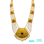 A 22kt gold traditional Punjabi Peepli Pata set with a red stone in the middle of the pendant and hanging pearls is cherished piece of jewelry. 153.3 gm