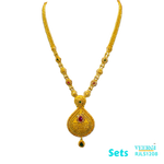 A 22kt gold traditional Indian design with cubic zirconia, ruby, and emerald leaf-looking pendant is a unique and eye-catching piece of jewelry, perfect for special occasions, cultural celebrations. 87.4 gm