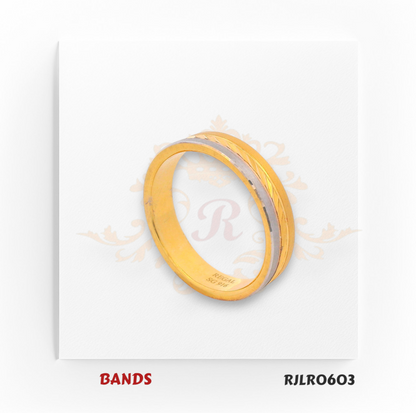 Crafted in 22kt gold, this two-tone band showcases a smooth yellow gold surface with an elegant white gold diagonal accent. Model RJLR0603 delivers a contemporary look with timeless appeal.