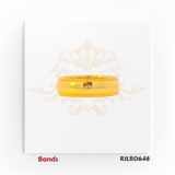 An elegant 22kt yellow gold band featuring a smooth brushed finish complemented by delicate ridged borders along the edges, creating a refined and timeless look. Model: RJLR0648.