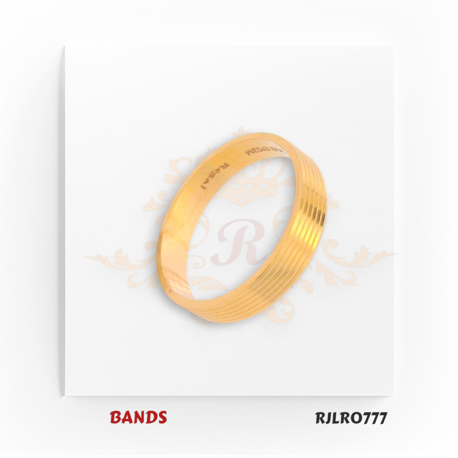 Elegant and minimal, this 22kt yellow gold band features fine parallel ridges for a sophisticated textured look. Model RJLR0777 blends classic style with modern simplicity.