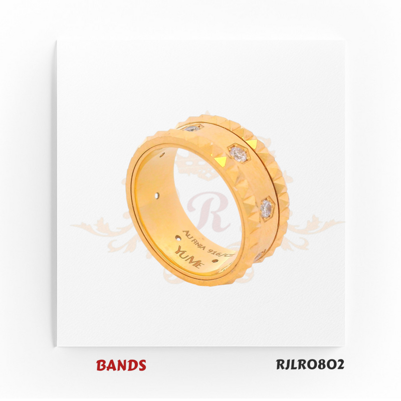 Striking 22kt yellow gold band with sharp faceted edges and bezel-set diamond accents, exuding a refined yet masculine elegance. Model RJLR0802.