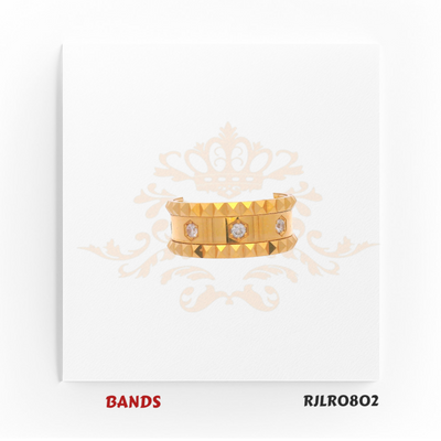 Bold 22kt yellow gold band with a faceted edge and bezel-set diamond accents. A luxurious and masculine design. Model number RJLR0802.