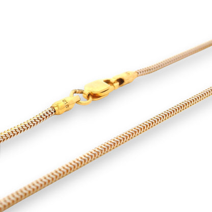 Detailed view of 22K gold baby chain (RJC30873a) highlighting its two-tone braided links and premium lobster clasp. A Regal Jewels Chicago creation combining safety, beauty, and refined gold craftsmanship for little ones.