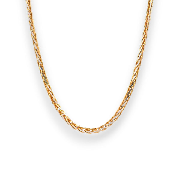 Two-tone 22K gold and rhodium baby chain featuring an elegant twisted link pattern, crafted with precision for a sleek, modern look.
