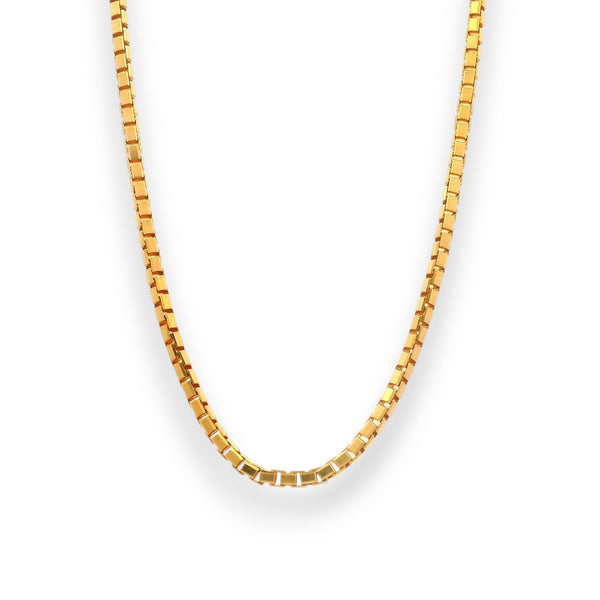 Close-up of 22K two-tone gold baby chain with intricate twisted links and a secure lobster clasp, showcasing fine craftsmanship and radiant shine.