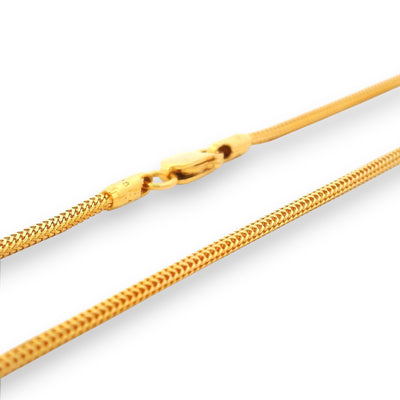 Close-up of 22K gold baby chain (RJC30881A) highlighting its intricate braided-link craftsmanship and sturdy clasp. Designed by Regal Jewels Chicago, blending purity, style, and safety for newborns and toddlers.