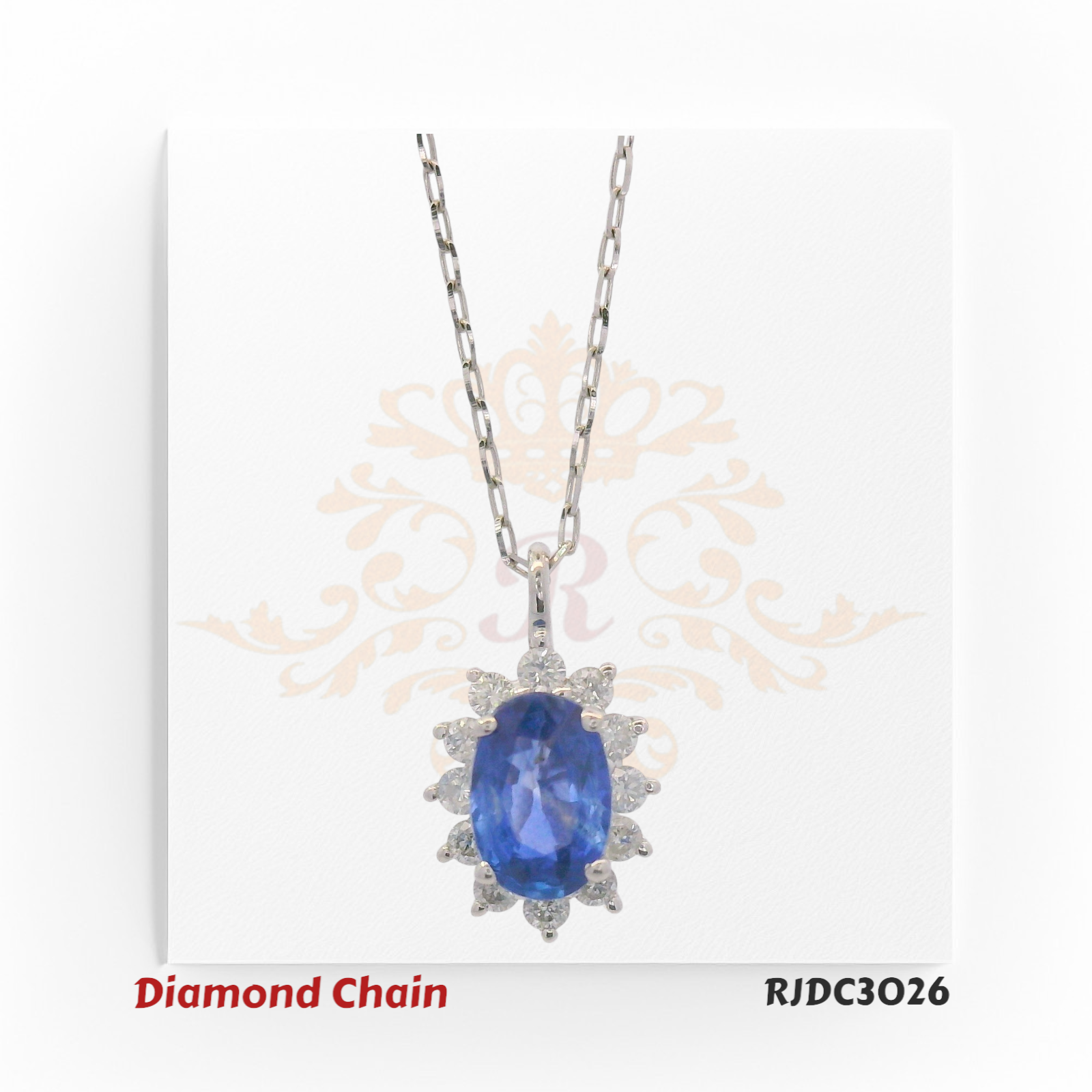 Elegant platinum and 18kt chain featuring a blue sapphire with diamond halo – RJDC3026