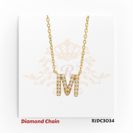 Elegant yellow gold necklace showcasing an “M”-shaped pendant, lavishly encrusted with dazzling round-cut diamonds. Paired with a classic gold link chain, model RJDC3034 exudes sophistication and timeless appeal.
