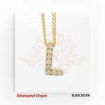 Minimalist yellow gold diamond chain showcasing a pendant in the form of the letter "L", fully encrusted with round-cut diamonds. The pendant is suspended from a sleek, twisted rope-style gold chain, set against a white backdrop with a subtle ornamental crown and floral motif. Model number RJDC3039 appears at the bottom.