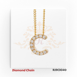 Polished yellow gold diamond chain featuring a "C" shaped pendant, encrusted with shimmering round-cut diamonds. Attached to a twisted gold chain, set against a refined white background with an ornamental crown motif. Model number RJDC3040.