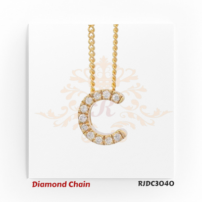 Polished yellow gold diamond chain featuring a "C" shaped pendant, encrusted with shimmering round-cut diamonds. Attached to a twisted gold chain, set against a refined white background with an ornamental crown motif. Model number RJDC3040.