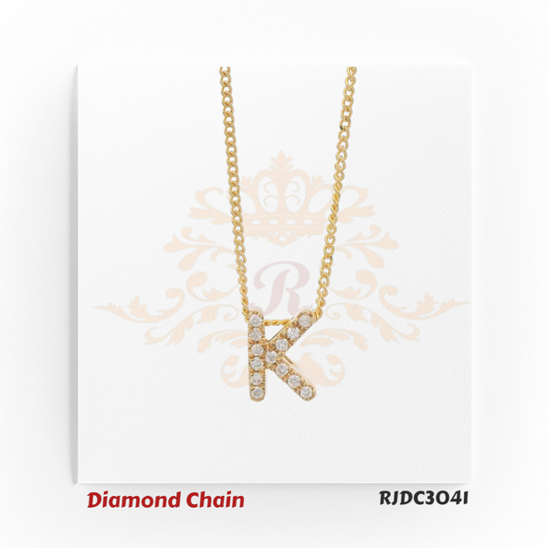 Brilliant yellow gold necklace showcasing a “K”-shaped pendant, lavishly adorned with shimmering round-cut diamonds. Suspended from a twisted rope-style gold chain, model RJDC3041 combines timeless elegance with radiant sparkle.